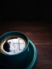 cup of coffee on wooden table