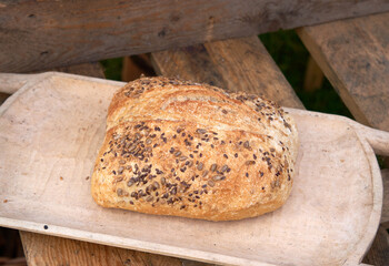 Display of organic country baked loaf of bread
