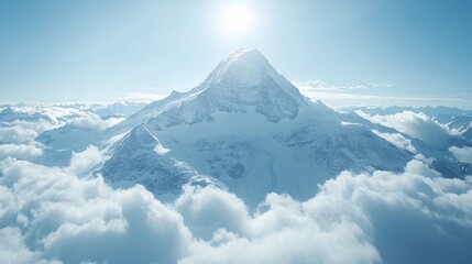 Majestic snow-capped mountain peak rises above soft white clouds under bright sunlight