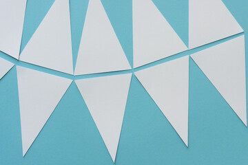 white paper isosceles triangles on blue