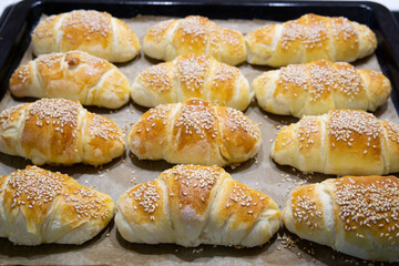 Homemade mini croissants on a sheet pan