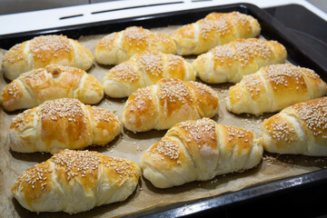 Homemade mini croissants on a sheet pan