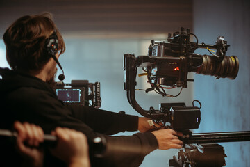 Professional cinema and video camera on the set. Shooting shift, lighting fixtures, shooting...