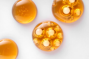 Abstract various golden yellow bubbles oil or serum with copy space background. cosmetic or spa...