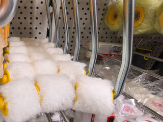 Discovering painting tools in a vibrant hardware store aisle