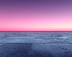 Pink sunset over calm water, concrete foreground.