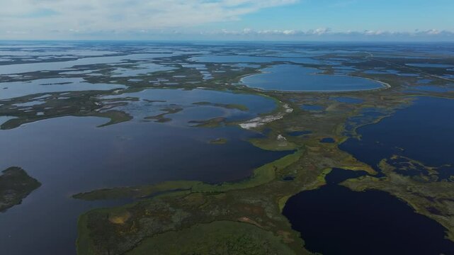 Lakes. Vast wetlands and numerous water bodies stretch across a remote area