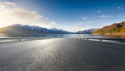 asphalt road structures and lake with mountain scenery