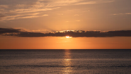 Sunset in the sea in orange tones, Sardinia