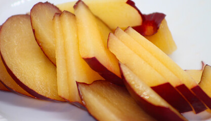 plum with selective focus. sliced ​​plum. cut plum. plum prepared for eating.
