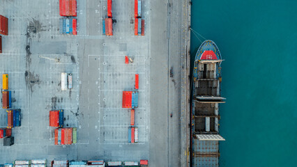 Aerial photography of containers for maritime transport of goods. Cargo ship in the port. Importation of products. Logistics park.