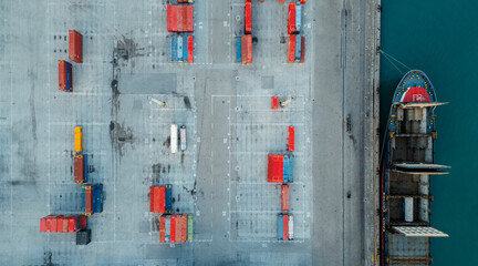 Aerial photography of containers for maritime transport of goods. Cargo ship in the port. Importation of products. Logistics park.