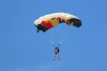 Skydiver in a blue sky	