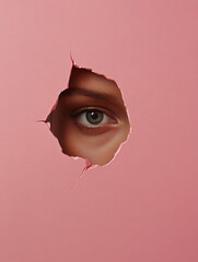 Stylized Portrait of a Woman Peeking Through a Torn Circular Hole in a Pink Background,...