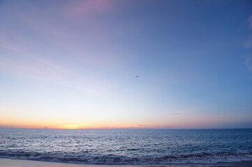 Tranquil Sunset Over Calm Sea With Vibrant Sky and Soft Waves