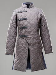 Historical fashion. Medieval knight cloth. Padded jacket gambeson.