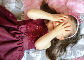 Portret of pretty little girl in crown and dress