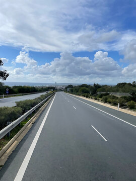 Scenic Highway Road Leading to Ayia Napa with Lush Greenery and Blue Skies