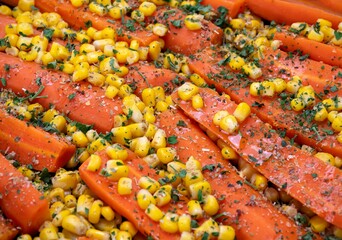 detail of a dish with carrots and corn