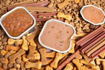Top view of different types of dog food, dried treats. Dog food concept.