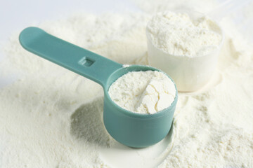 Pile of protein powder and scoops, closeup