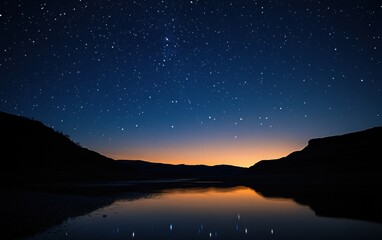 Naklejka premium Starry Night Lake Serenity: Mountains Reflecting Celestial Beauty