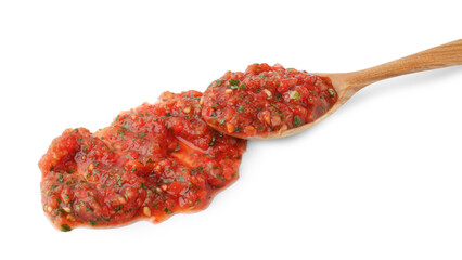 Tasty salsa sauce in spoon isolated on white