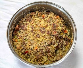 Authentic Brazilian farofa prepared with toasted cassava flour, bacon, onion and typical spices. Brazilian food