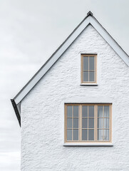 Obraz premium Minimalist white house with two windows.