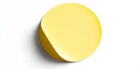 A yellow circular paper sticker label isolated on a white background