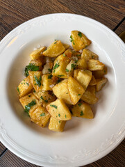 A plate of crispy roast potatoes.