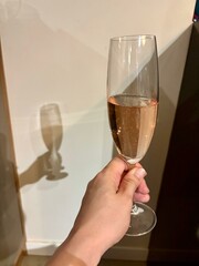 Toasting myself with a glass of rosé sparkling wine