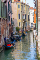 Obraz premium Italy, Venice. Gondolas in a small canal.