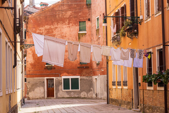 Italy, Venice. Arsenale neighborhood, Castello district. Laundry hanging to dry between buildings.