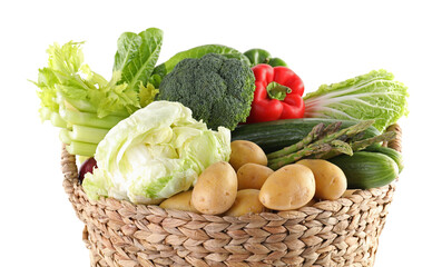 Different ripe vegetables in basket isolated on white