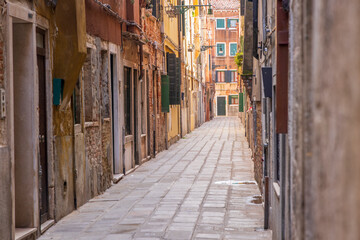 Fototapeta premium Italy, Venice. Castello district. Narrow stone street.