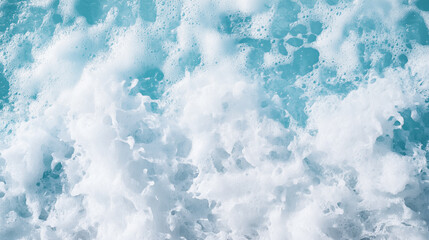 Obraz premium Abstract background, dynamic close-up of ocean waves with white foam and turquoise water