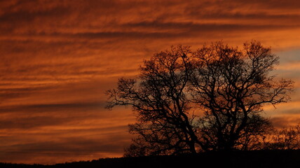 Obraz premium Moody Cloudy Orange Sunset Sky