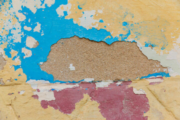 Cuba, Havana. Stucco, wood building, blue and yellow, maroon, peeling paint. 2016-04-03