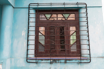 Cuba, Havana. Regla district. Colorful stain glass windows. Peeling paint. 2016-04-03