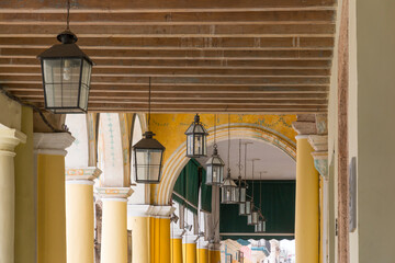 Cuba, Havana.  Archways with hanging electric lanterns, located at Ignace Street, corner Muralla street, Plaza Vieja (Old Square). 2016-03-25