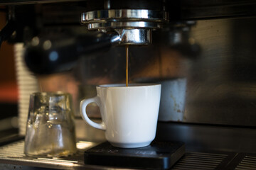 Fresh Espresso Shot Brewing in a Coffee Shop