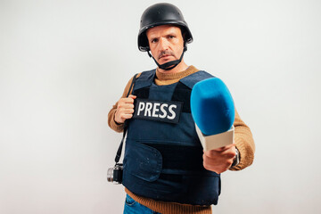 Reporter with bulletproof vest.