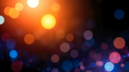 abstract background featuring glittering lights in vibrant blue and gold shades, scattered against a dark black gradient.