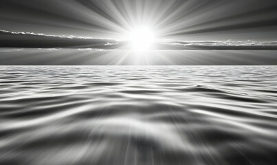 Serene black and white seascape photo; sun rays breaking through clouds over calm ocean waters. Perfect for meditation, relaxation, and nature themes.