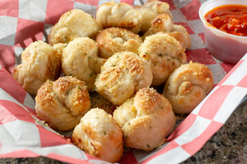 A view of a basket of garlic knots.