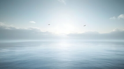 Obraz premium Serene seascape at dawn; misty mountains meet calm waters under a soft, bright sun. Two birds soar, adding peaceful tranquility.