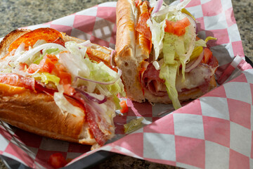 A view of an Italian sandwich in a basket.