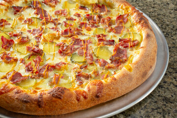 A view of a pastrami pizza.