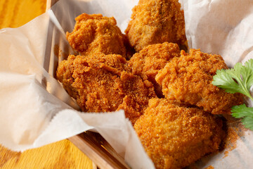 A view of a basket of cajun style chicken wings, as a background.